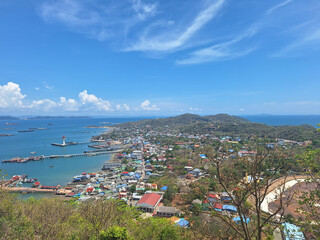The hills of Koh Sichang are full of colorful houses, overlooking the community and the port. View from Chulachomklao mountain Peak. The top sights in Ko Sichang Island, Chonburi, Thailand.