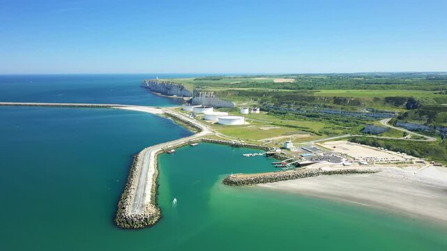 The pier of the port of Antifer at the foot of the cliffs in Europe, in France, in Normandy, near Etretat, in summer, on a sunny day.&nbsp;