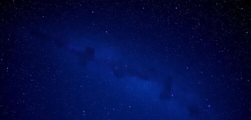 Fototapeta premium Deep midnight blue sky canvas speckled with vibrant purple nebulae and countless stars, universe, ethereal