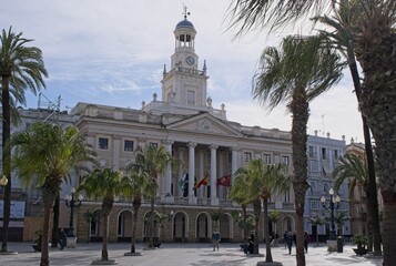 Cadiz, Spain - Mar 19, 2025: Walking in Cadiz. City Hall. Streets, buildings. Lifestyle in the urban area. Sunny spring day. Selective focus