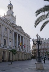 Cadiz, Spain - Mar 19, 2025: Walking in Cadiz. City Hall. Streets, buildings. Lifestyle in the urban area. Sunny spring day. Selective focus