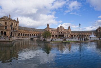 Seville, Spain - Mar 23, 2025: Walking in Seville. Plaza de Espana. Streets, buildings. Lifestyle in the urban area. Cloudy spring day. Selective focus