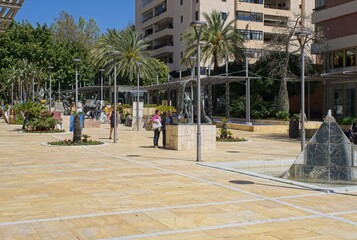 Marbella, Spain - Mar 30, 2025: Walking in Marbella. Streets, buildings. Lifestyle in the urban area. Sunny spring day. Selective focus