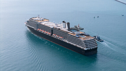 Aerial view of beautiful white cruise ship above luxury cruise in the ocean sea at early in the morning time concept smart tourism travel on holiday take a vacation time on summer