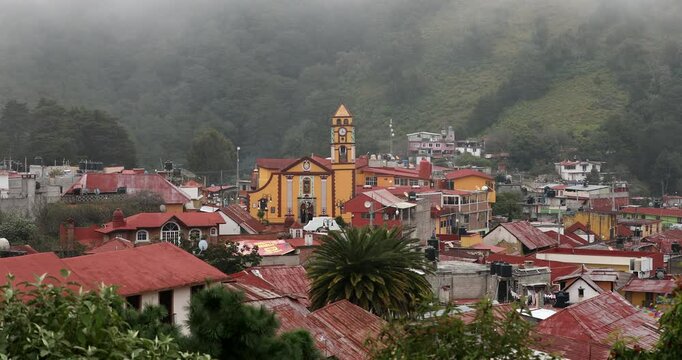 Foggy morning view of the historic church and cityscape of the pueblo of Pinal de Amoles, Quer&eacute;taro, Mexico.