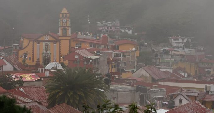 Foggy morning view of the historic church and cityscape of the pueblo of Pinal de Amoles, Quer&eacute;taro, Mexico.