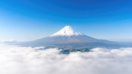 Majestic mountain peak, snow-capped, above clouds
