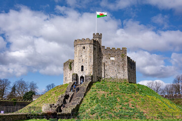 Cardiff castle fortress with waving flag 
