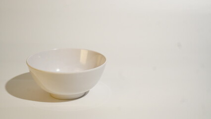 Minimalist White Bowl Composition with Soft Lighting and Ample Copy Space