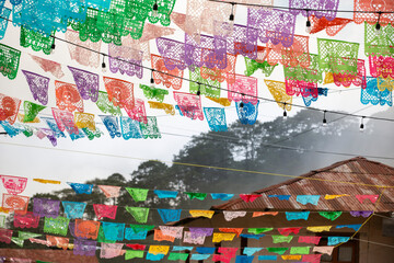 Naklejka premium Beautiful Day of the Dead decorations hang in the historic downtown heart of Pinal de Amoles, Querétaro, Mexico.