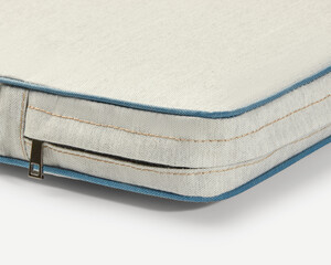 Close-up of removable cushion cover with zipper showing high-quality fabric and stitching
