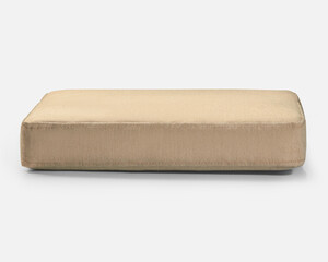 Beige rectangular cushion resting on white surface