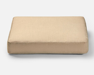 Beige square comfortable cushion resting on white background