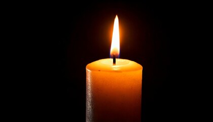 One candle burning slowly isolated on pitch black background