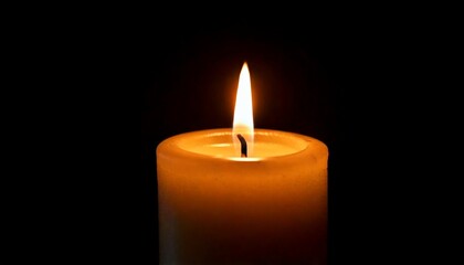 One candle burning slowly isolated on pitch black background