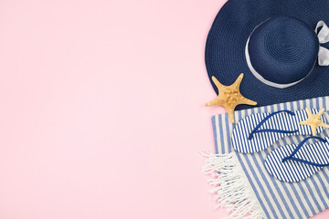 Blue beach accessories on color background, top view. Copy space for text
