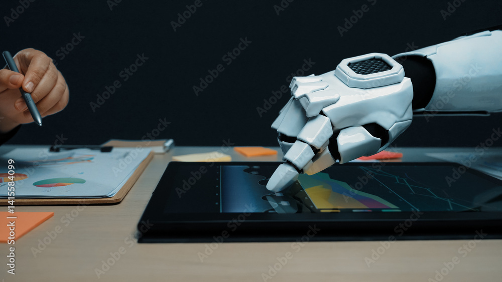Poster a futuristic robotic hand engages with a digital tablet showing colorful graphs in a sleek office sp