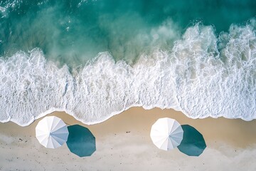 Aerial View White Umbrellas on Sandy Beach Meeting Azure Waves, Scenic Coastal Shot