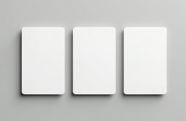 Three blank trading cards mockup with rounded corners isolated on gray background. Cards arranged in a row, ready for design. Perfect for branding product presentation.