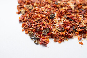 Dried vegetable mix of tomatoes onions and olives. Natural organic food seasoning. Vegetable soup mix. Spices top view