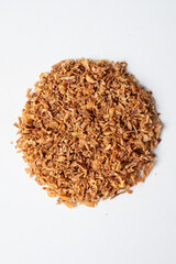 Fried onions. A pile of onion shavings. Deep-fried vegetables. Crispy onion flakes - a culinary seasoning