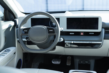 Electric car interior luxury. Interior of prestige modern car. Leather comfortable seats, dashboard...