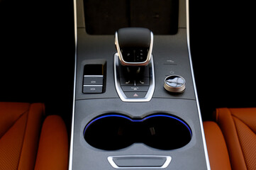 Selector automatic transmission with leather in the interior of a modern car.