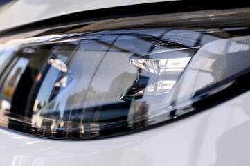 Close up of the headlight of a new modern car