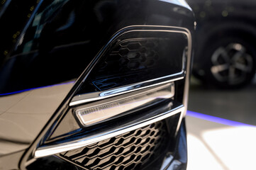 Close up of the headlight of a new modern car