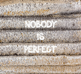 Nobody is perfect symbol. Concept words Nobody is perfect on beautiful grey stone. Beautiful grey mountain stone background. Business motivational lifestyle and nobody is perfect concept. Copy space.