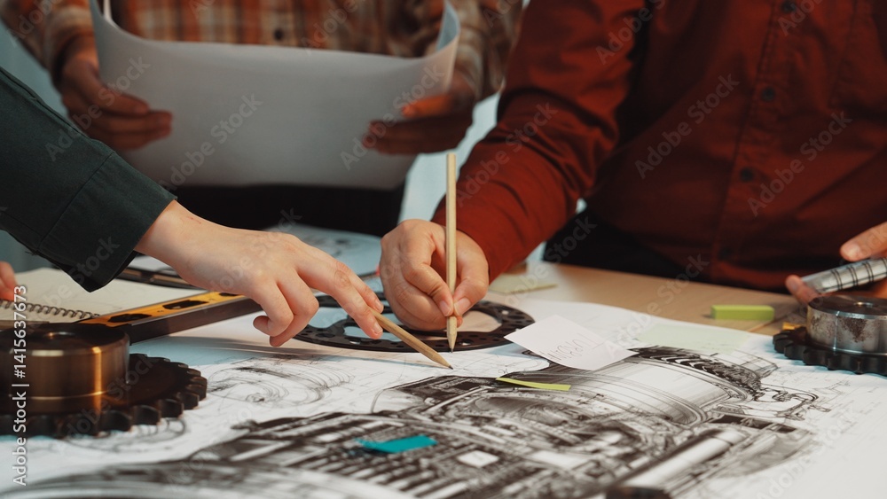 Poster a group of engineers collaborates on intricate blueprints of mechanical components in a workshop, sh