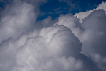 Cloudy skies. Cumulus clouds in sky. Cloud wallpaper. Sky background. Cloudy sky with sunlight. White clouds wallpaper. Blue sky and white clouds background. Idyllic fluffy clouds. Calm nature.