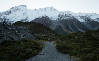 Hiking trail path walkway leading to snow covered Southern Alps mountains, alpine nature landscape...