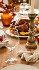 roasted turkey centerpiece on a rustic wooden thanksgiving table