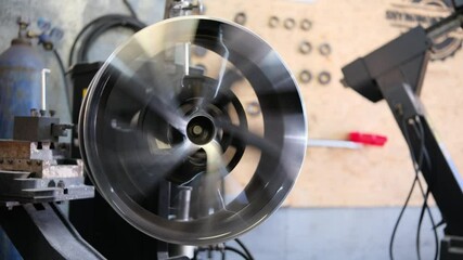 Car disk spinning on repair machine