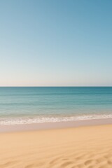 Obraz premium Bright Sunny Beach With Gentle Waves and Clear Sky at Midday