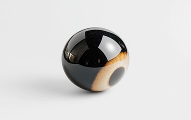 Fototapeta premium Black and tan sphere levitates on a stark white background. The sphere has a glossy finish and resembles an eye. The image is minimalist and clean