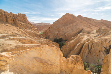A sand dune against a blue sky