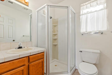 A beautifully designed bathroom with two sinks, a tub, and a mirror