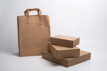 Paper bag. Kraft paper shopping bag. Brown paper bag with handle. Empty paper grocery bag. Recycled supermarket cardboard packaging. Space for text