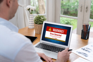 Virus warning alert on computer screen detected brisk cyber threat , hacker, computer virus and...