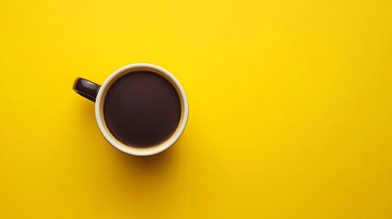Cup of black coffee on yellow background, top view with copy space