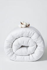 rolled white cotton comforter showcases softness and purity