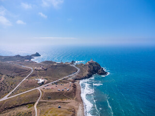 Aerial view of The Gata lighthouse, located in Cabo de Gata, was built in 1863, 18 meters high. Cabo de Gata is a natural area of ​​semi-desert character and volcanic past