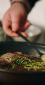 Recipe, hands and person with steak in frying pan for meal preparation, healthy ingredients and sear meat cuisine. Closeup, chef and cooking beef food with thyme for nutrition, protein diet or dinner