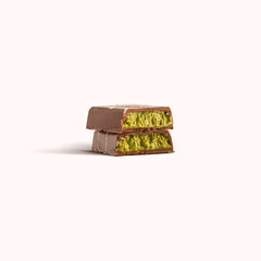 Dubai chocolate bar with pistachio and kunafa filling isolated on white