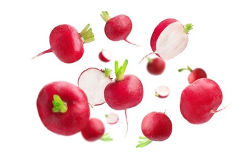 Fresh ripe radishes falling on white background