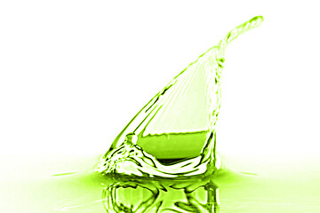 Beautiful green water splashing against white background