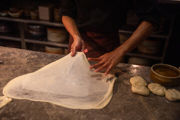 Making roti canai or paratha