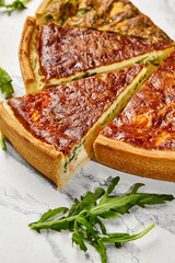 Delicious homemade quiche with salmon and spinach filling sliced and ready to serve